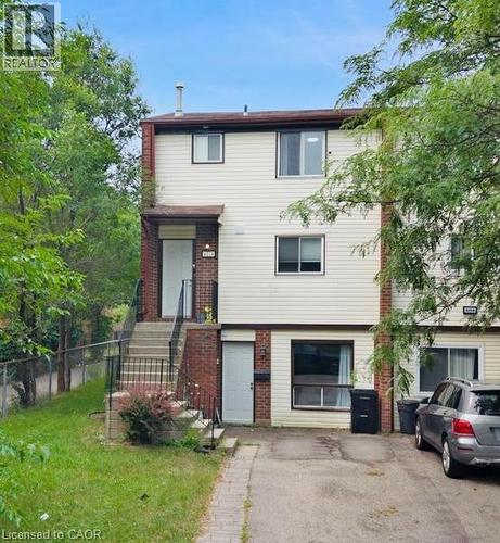Multi-level exterior featuring brick and siding finishes - 421 Bairstow Crescent, Waterloo, ON - Outdoor