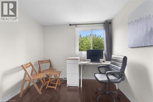 Room featuring dark wood-finish flooring, white baseboards, and a white ceiling - 421 Bairstow Crescent, Waterloo, ON - Indoor Photo Showing Office