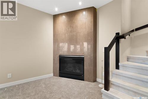 6110 Wascana Court, Regina, SK - Indoor Photo Showing Other Room With Fireplace