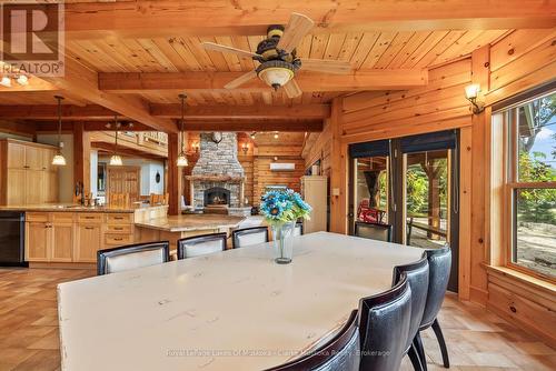 1040 7Th Heaven Lane, Bracebridge (Muskoka (N)), ON - Indoor Photo Showing Dining Room With Fireplace
