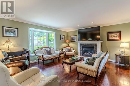 383 Peek-A-Boo Trail, Tiny, ON - Indoor Photo Showing Living Room With Fireplace