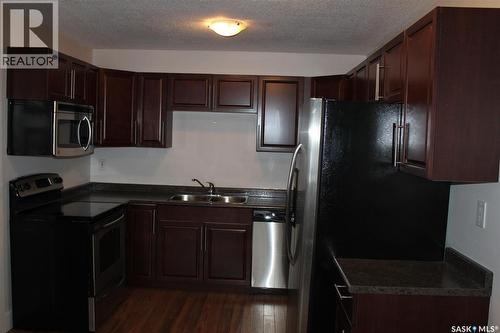 2 2106 Ste Cecilia Avenue, Saskatoon, SK - Indoor Photo Showing Kitchen With Double Sink