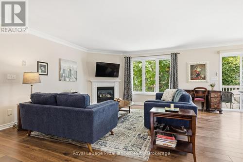 31 Huron Drive, Brighton, ON - Indoor Photo Showing Living Room With Fireplace