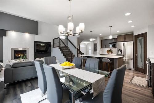 3 Tennant Gate, Winnipeg, MB - Indoor Photo Showing Dining Room With Fireplace