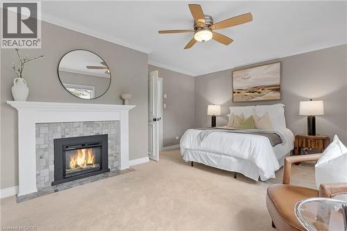 203 Forsyth Drive, Waterloo, ON - Indoor Photo Showing Bedroom With Fireplace