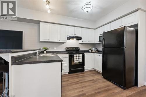 Kitchen - 50 Howe Drive Unit# 9D, Kitchener, ON - Indoor Photo Showing Kitchen With Double Sink