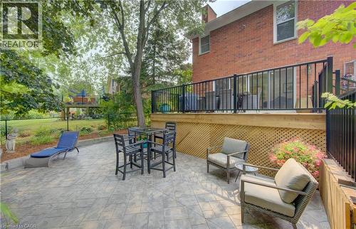 Lower-level patio with stamped concrete paving - 307 Grand River Boulevard, Kitchener, ON - Outdoor With Deck Patio Veranda With Exterior