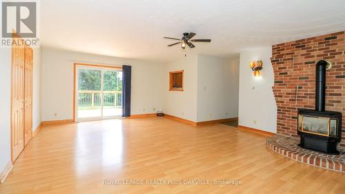 52 Denney Drive, Essa, ON - Indoor Photo Showing Other Room With Fireplace