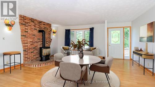 Dining Area Virtually Staged - 52 Denney Drive, Essa, ON - Indoor Photo Showing Dining Room With Fireplace