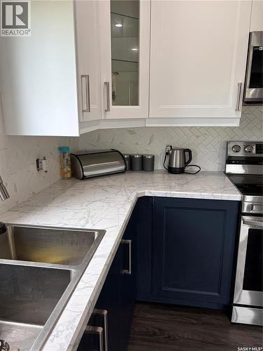 4 Mission Bay, Lebret, SK - Indoor Photo Showing Kitchen With Double Sink