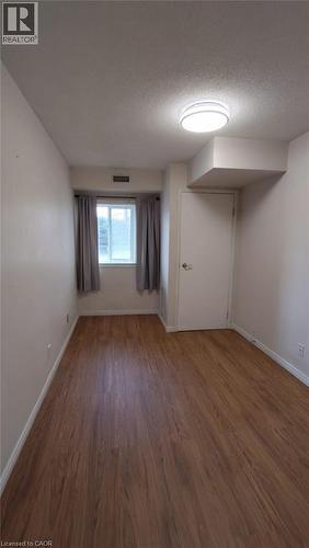 New light fixture 2026 - 500 Westmount Road W Unit# 103, Kitchener, ON - Indoor Photo Showing Other Room