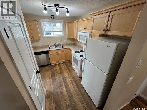 45 4640 Harbour Landing Drive, Regina, SK - Indoor Photo Showing Kitchen With Double Sink