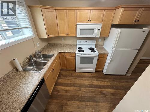 45 4640 Harbour Landing Drive, Regina, SK - Indoor Photo Showing Kitchen With Double Sink