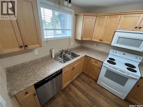 45 4640 Harbour Landing Drive, Regina, SK - Indoor Photo Showing Kitchen With Double Sink