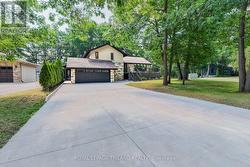 Back outside, parking for 6 w/ driveway 1 + garage - 