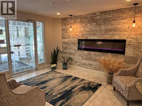 3221 Centennial Drive Unit# 401, Vernon, BC - Indoor Photo Showing Living Room With Fireplace