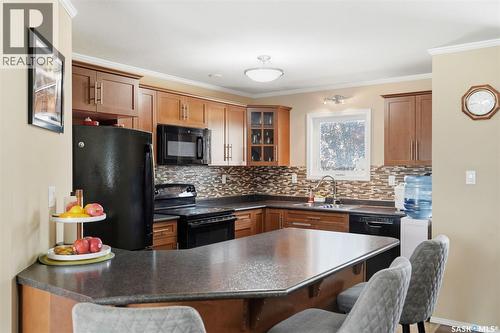406 225 Hassard Close, Saskatoon, SK - Indoor Photo Showing Kitchen With Double Sink