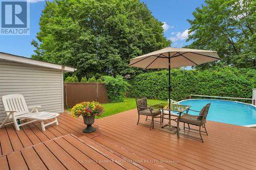 Twenty feet hedges = ultimate privacy - 636 Malartic Avenue, Ottawa, ON - Outdoor With Above Ground Pool With Deck Patio Veranda