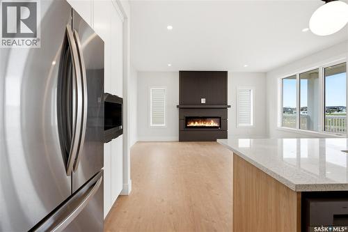 218 Veterans Drive, Warman, SK - Indoor With Fireplace