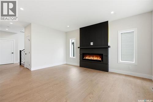 218 Veterans Drive, Warman, SK - Indoor Photo Showing Living Room With Fireplace
