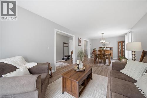 Living area featuring light gray wall paint, wood-finish flooring, and white trim - 79 Beaverbrook Crescent, Cambridge, ON - Indoor Photo Showing Living Room