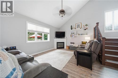 Living area featuring a vaulted ceiling and wood-finish flooring - 79 Beaverbrook Crescent, Cambridge, ON - Indoor Photo Showing Living Room With Fireplace