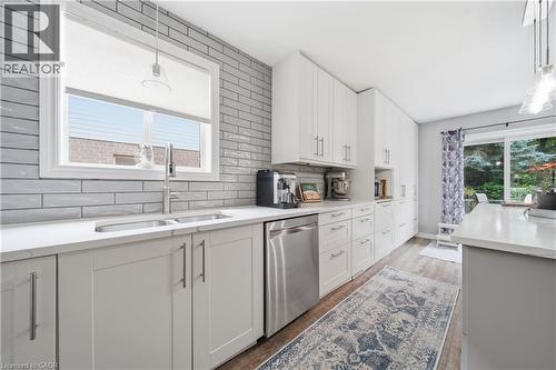 Modern kitchen featuring white shaker cabinetry and stainless-steel appliances - 79 Beaverbrook Crescent, Cambridge, ON - Indoor Photo Showing Kitchen With Double Sink