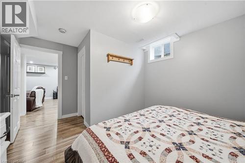 Bedroom featuring neutral wall tones, wood-finish flooring, a window, and a flush-mount ceiling light - 79 Beaverbrook Crescent, Cambridge, ON - Indoor Photo Showing Bedroom