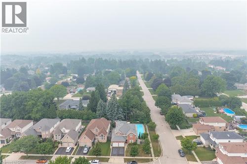 Aerial overview of a residential neighborhood with mature tree canopies - 79 Beaverbrook Crescent, Cambridge, ON -  With View