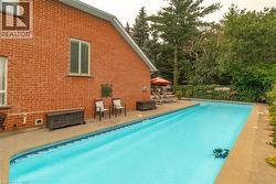 Rectangular inground swimming pool with a concrete surround - 