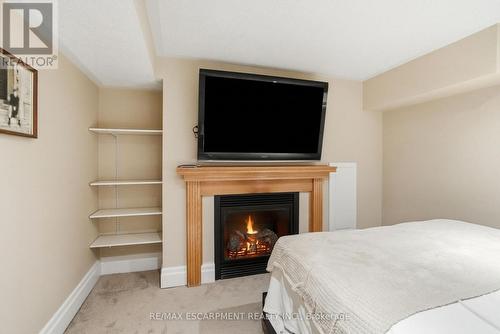 344 East 36Th Street, Hamilton, ON - Indoor Photo Showing Bedroom With Fireplace