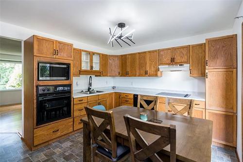 241 Lake Ridge Rd, Winnipeg, MB - Indoor Photo Showing Kitchen With Double Sink