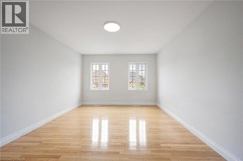 Bright interior space featuring light wood-finish flooring - 5 Freshspring Drive, Brampton, ON - Indoor Photo Showing Other Room