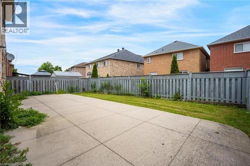 Expansive concrete patio with a grass area - 5 Freshspring Drive, Brampton, ON - Outdoor