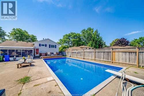 5122 Colbourne Drive, Windsor, ON - Outdoor With In Ground Pool With Backyard