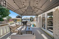 Covered outdoor deck with string lighting - 