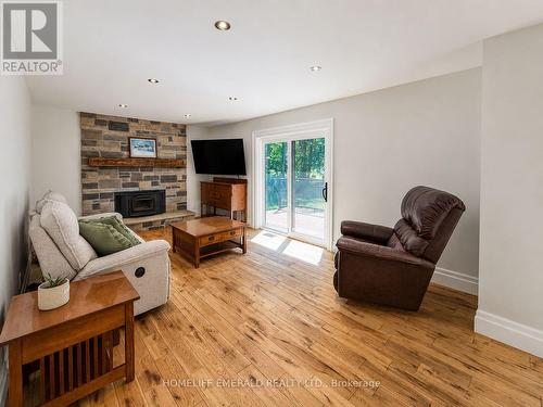 2391 Seadon Road, Springwater, ON - Indoor Photo Showing Living Room With Fireplace