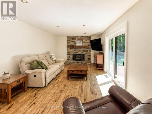 2391 Seadon Road, Springwater, ON - Indoor Photo Showing Living Room With Fireplace