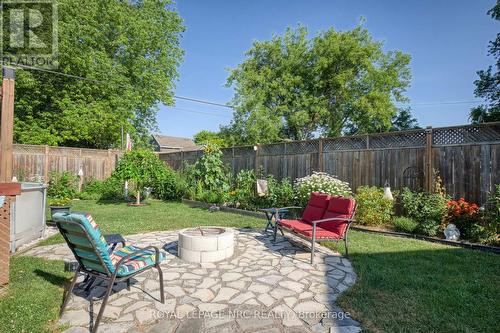 Lush gardens and fire pit - 294 Davis Street, Port Colborne (Killaly East), ON - Outdoor With Backyard