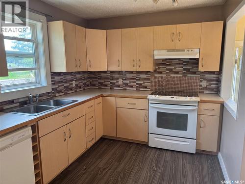 100 105Th Street W, Saskatoon, SK - Indoor Photo Showing Kitchen With Double Sink