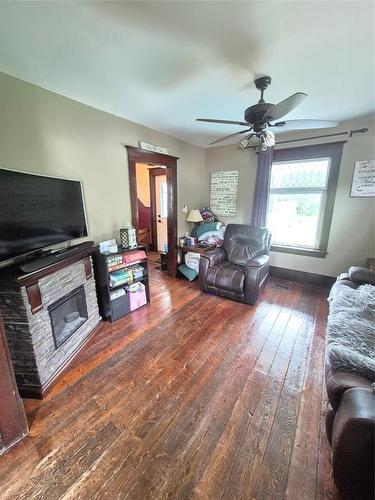 91157 97N Road, Minnedosa, MB - Indoor Photo Showing Living Room With Fireplace