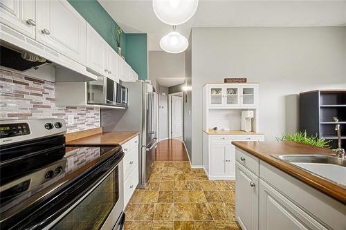 107 Paul Martin Dr, Winnipeg, MB - Indoor Photo Showing Kitchen With Stainless Steel Kitchen With Upgraded Kitchen