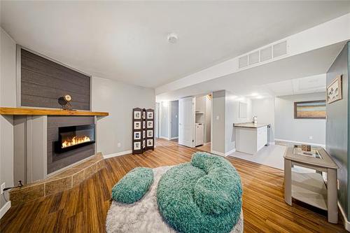 107 Paul Martin Dr, Winnipeg, MB - Indoor Photo Showing Living Room With Fireplace