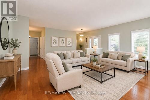 virtually staged - 60 Martyn Drive, Wasaga Beach, ON - Indoor Photo Showing Living Room