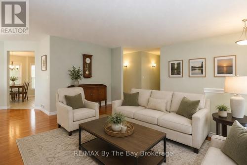 virtually staged - 60 Martyn Drive, Wasaga Beach, ON - Indoor Photo Showing Living Room