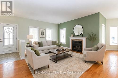 virtually staged - 60 Martyn Drive, Wasaga Beach, ON - Indoor Photo Showing Living Room With Fireplace