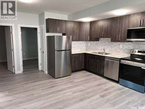 126 Bolstad Way, Saskatoon, SK - Indoor Photo Showing Kitchen With Double Sink With Upgraded Kitchen