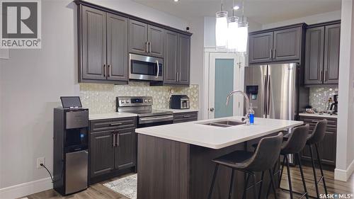 126 Bolstad Way, Saskatoon, SK - Indoor Photo Showing Kitchen With Double Sink With Upgraded Kitchen