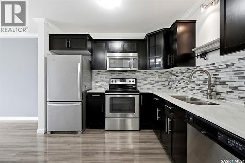 321 620 Cornish Road, Saskatoon, SK - Indoor Photo Showing Kitchen With Stainless Steel Kitchen With Double Sink With Upgraded Kitchen