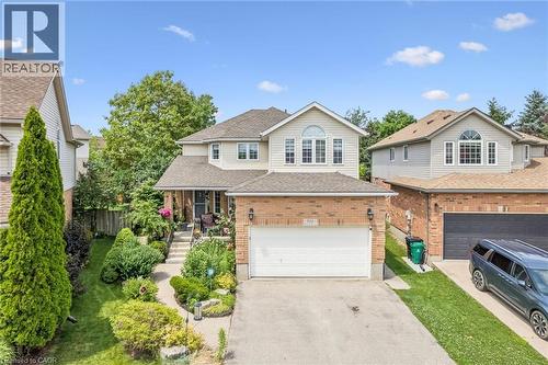 Two-story residence featuring a brick and siding exterior, an attached two-car garage, and a concrete driveway - 916 Rush Meadow Court, Kitchener, ON - Outdoor